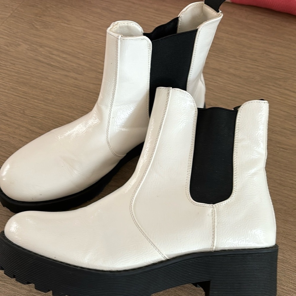 Cool white faux leather booties with thick black sole